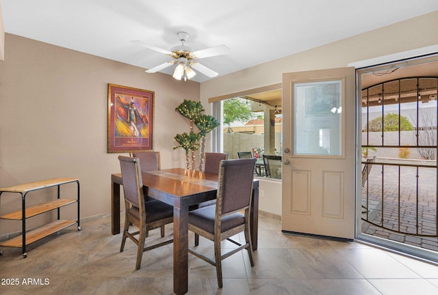 dining room featuring ceiling fan