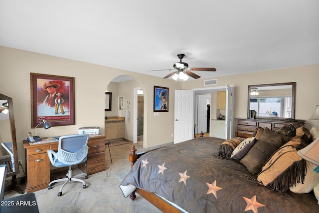 bedroom featuring visible vents, arched walkways, ceiling fan, and ensuite bathroom