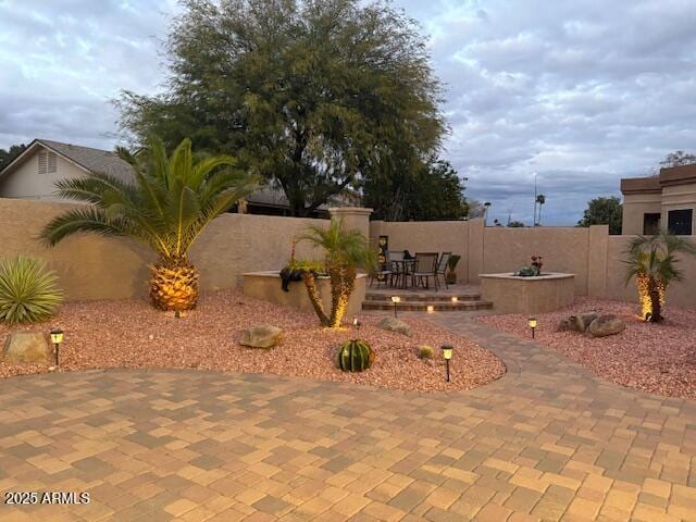 view of yard featuring a patio and a fenced backyard