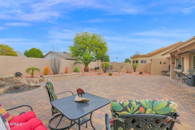 view of patio / terrace with outdoor dining area and a fenced backyard