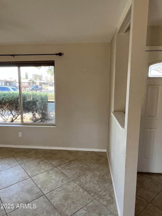 empty room with baseboards