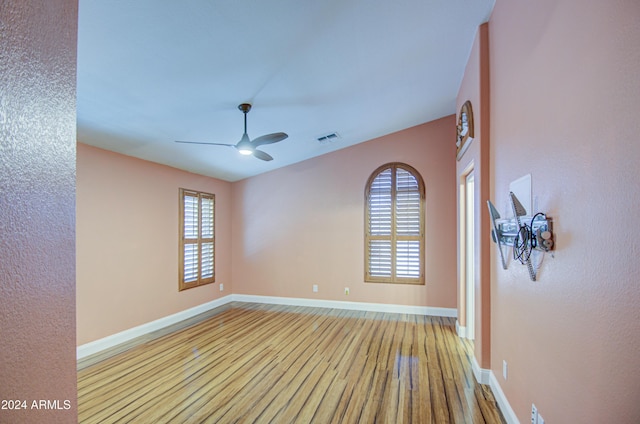 spare room with light hardwood / wood-style floors and ceiling fan