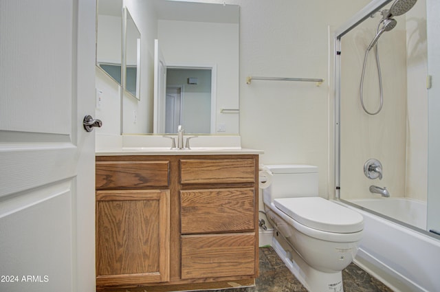 full bathroom with toilet, vanity, and shower / bath combination with glass door