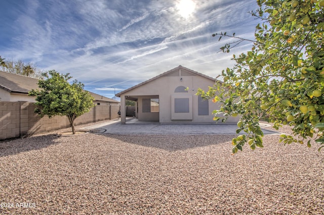 back of house featuring a patio area