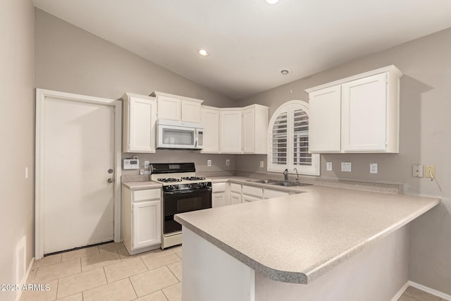 kitchen featuring lofted ceiling, sink, white cabinetry, range with gas stovetop, and kitchen peninsula