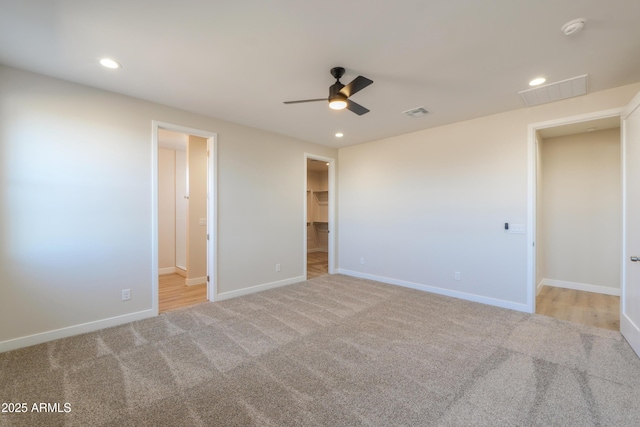 unfurnished bedroom featuring baseboards, carpet floors, and recessed lighting