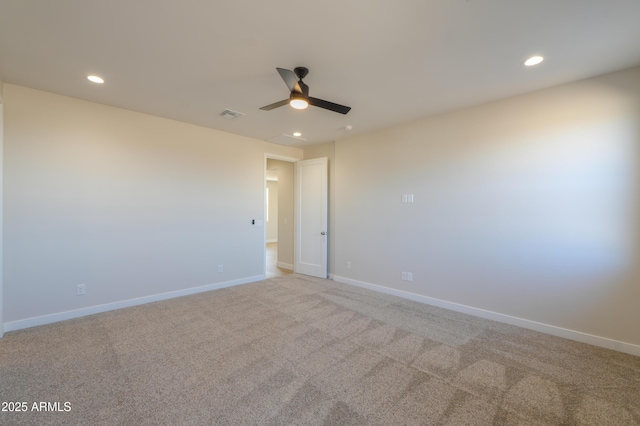 unfurnished room with recessed lighting, visible vents, and baseboards