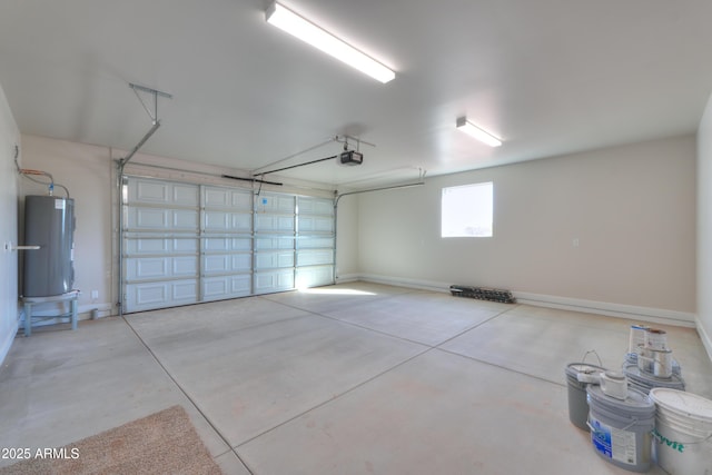 garage featuring water heater, baseboards, and a garage door opener