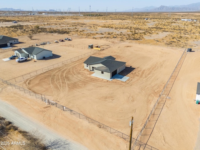 aerial view with view of desert, a rural view, and a mountain view