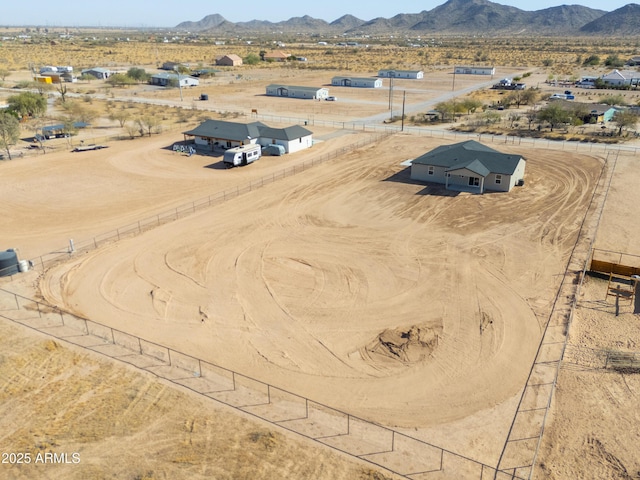 birds eye view of property with a mountain view, a desert view, and a rural view