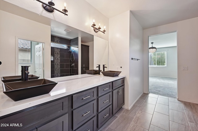 bathroom with vanity and a shower with shower door