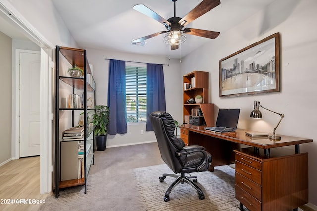 office space featuring ceiling fan and light wood-type flooring