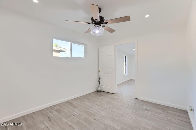 5827 N 22nd Dr, Phoenix, AZ 85015 - empty room with healthy amount of natural light, a ceiling fan, recessed lighting, and light wood finished floors