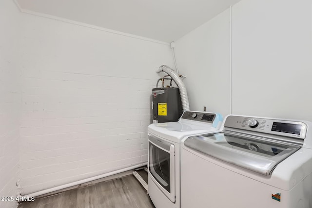5827 N 22nd Dr, Phoenix, AZ 85015 - laundry room with water heater, independent washer and dryer, and light wood-type flooring