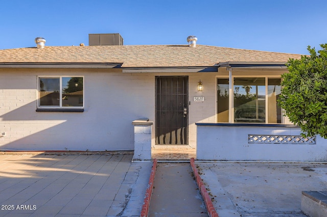 5827 N 22nd Dr, Phoenix, AZ 85015 - view of front of home featuring brick siding and a shingled roof