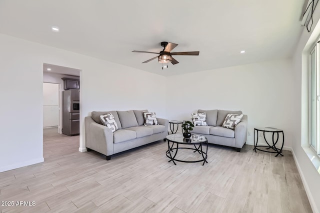 5827 N 22nd Dr, Phoenix, AZ 85015 - living room featuring a ceiling fan, light wood finished floors, and recessed lighting