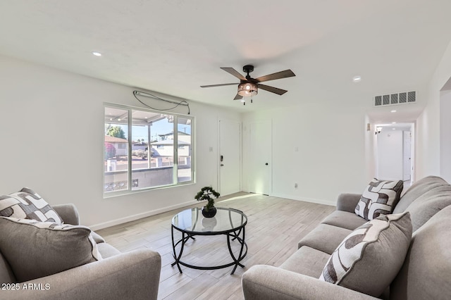 5827 N 22nd Dr, Phoenix, AZ 85015 - living area featuring light wood finished floors, ceiling fan, and recessed lighting
