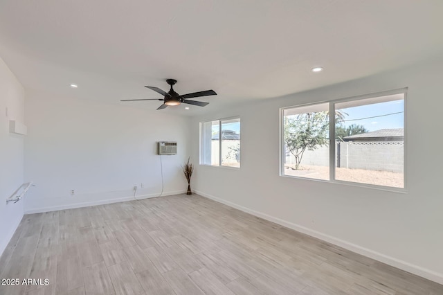 5827 N 22nd Dr, Phoenix, AZ 85015 - empty room featuring light wood-style flooring, recessed lighting, ceiling fan, and a wall unit AC