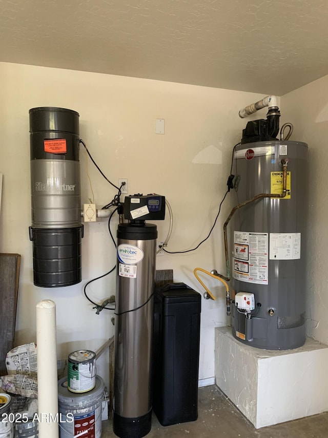 utility room featuring water heater