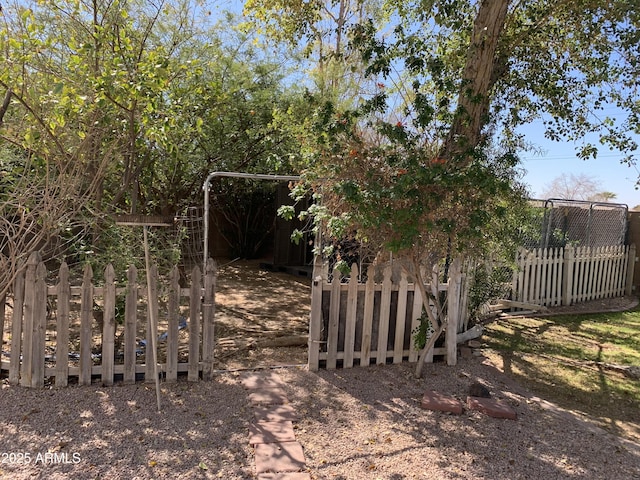 view of gate featuring fence