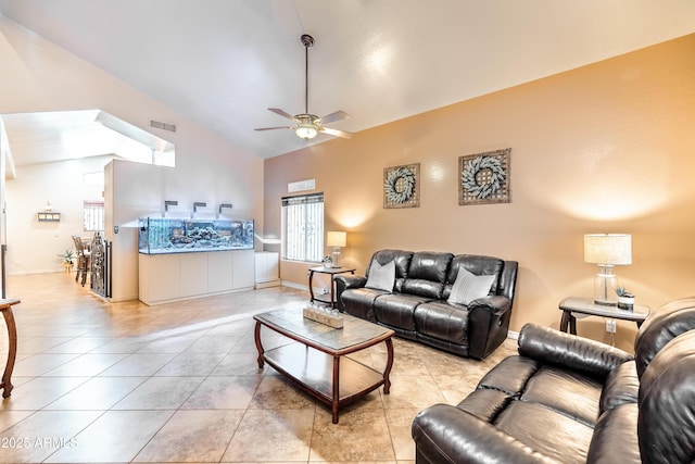 3511 W Allens Peak Dr, San Tan Valley, AZ 85144 - living area featuring lofted ceiling, ceiling fan, light tile patterned floors, and baseboards