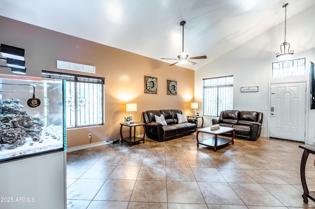 3511 W Allens Peak Dr, San Tan Valley, AZ 85144 - living room featuring a ceiling fan, high vaulted ceiling, light tile patterned floors, and baseboards