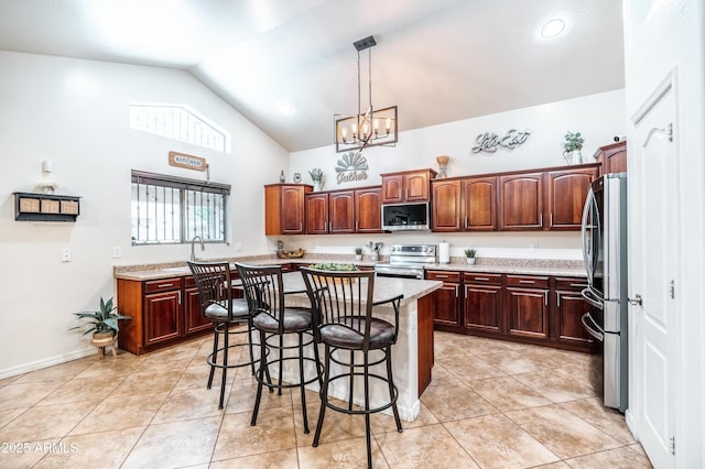 3511 W Allens Peak Dr, San Tan Valley, AZ 85144 - kitchen featuring appliances with stainless steel finishes, a breakfast bar area, a chandelier, high vaulted ceiling, and a center island