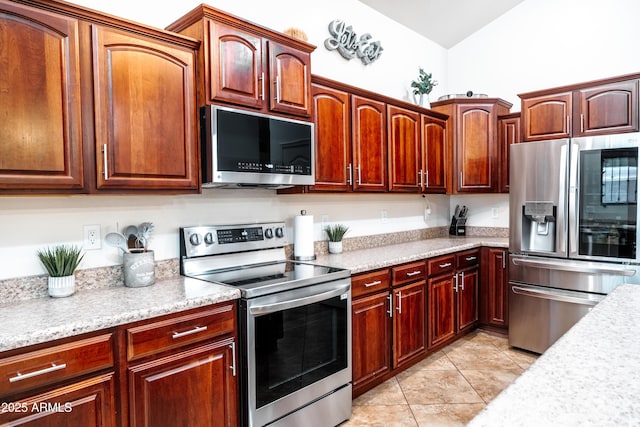3511 W Allens Peak Dr, San Tan Valley, AZ 85144 - kitchen with appliances with stainless steel finishes, light countertops, and light tile patterned floors