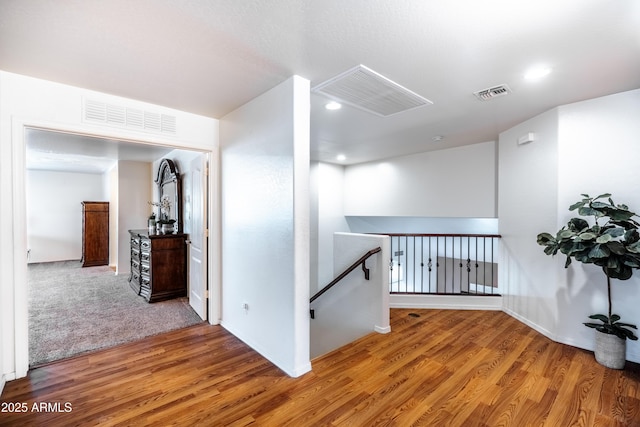 3511 W Allens Peak Dr, San Tan Valley, AZ 85144 - hallway with an upstairs landing, wood finished floors, baseboards, and recessed lighting