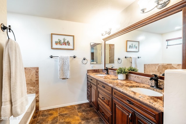 3511 W Allens Peak Dr, San Tan Valley, AZ 85144 - full bath featuring double vanity, a bathtub, and baseboards