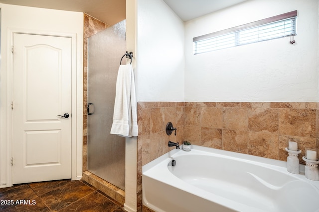 3511 W Allens Peak Dr, San Tan Valley, AZ 85144 - bathroom featuring a bath and a stall shower