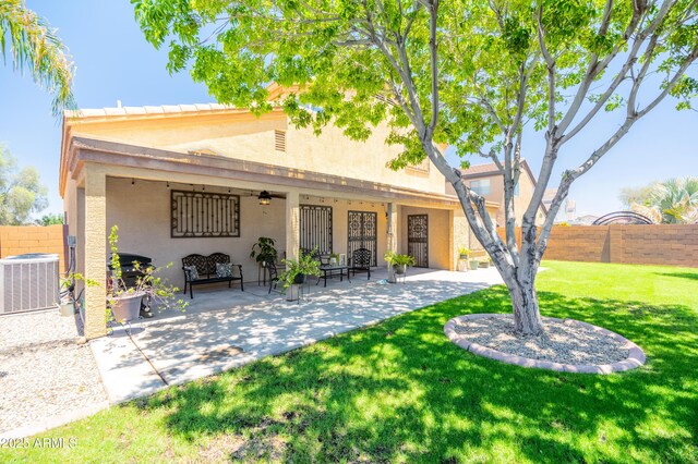 3511 W Allens Peak Dr, San Tan Valley, AZ 85144 - rear view of house with central air condition unit, stucco siding, a patio, and a ceiling fan