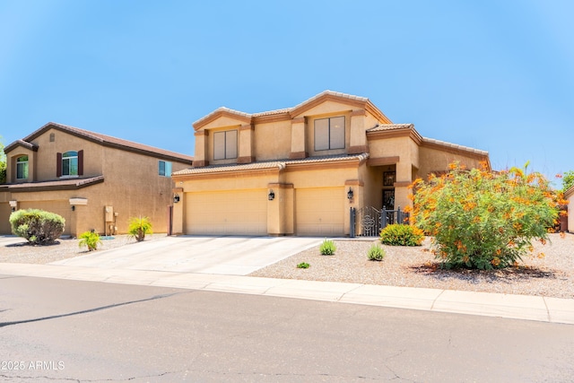3511 W Allens Peak Dr, San Tan Valley, AZ 85144 - mediterranean / spanish house with a garage, concrete driveway, stucco siding, and a tile roof