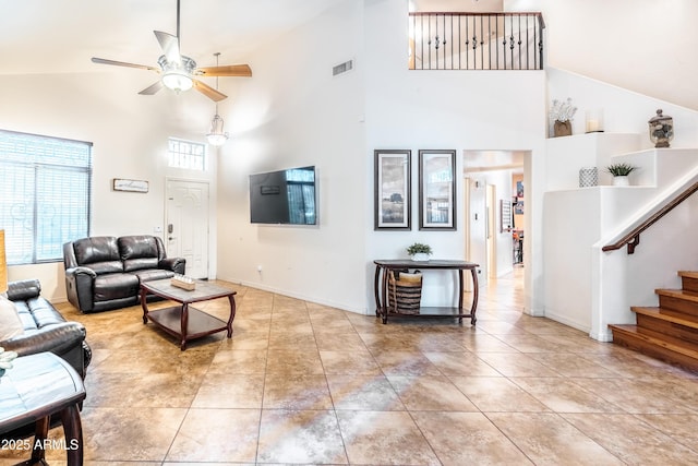 3511 W Allens Peak Dr, San Tan Valley, AZ 85144 - living room featuring high vaulted ceiling, a ceiling fan, stairs, tile patterned flooring, and baseboards