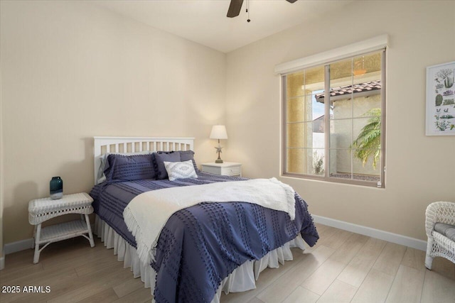 bedroom featuring hardwood / wood-style flooring and ceiling fan