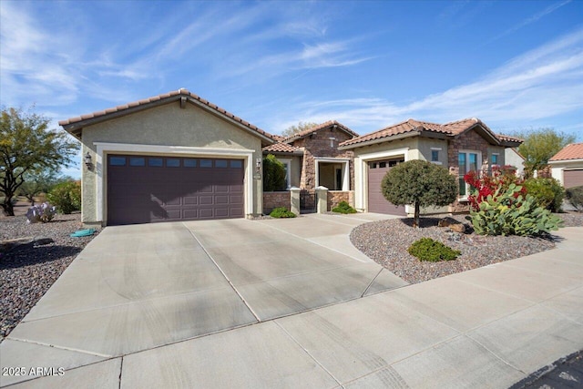 mediterranean / spanish house featuring a garage