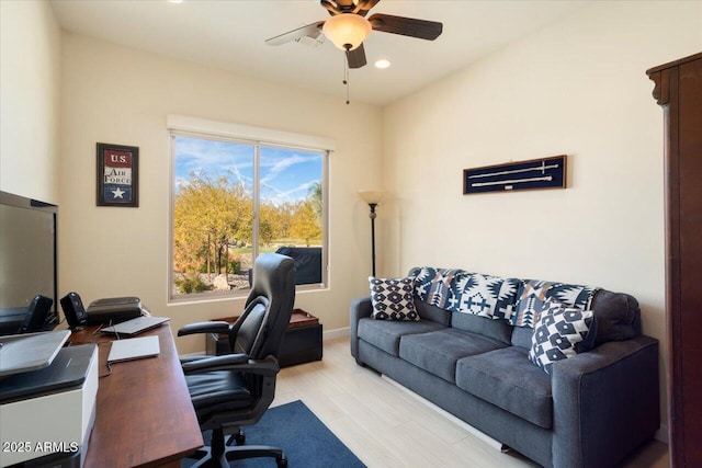 office featuring ceiling fan and light hardwood / wood-style flooring