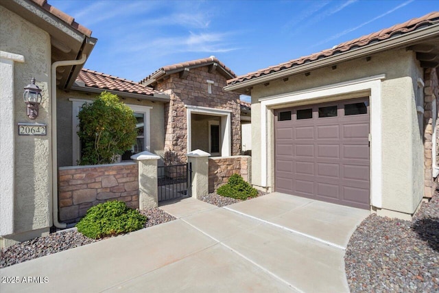 mediterranean / spanish home with a garage