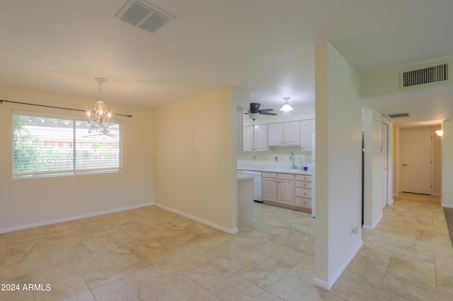 interior space with light tile patterned flooring, sink, and ceiling fan with notable chandelier