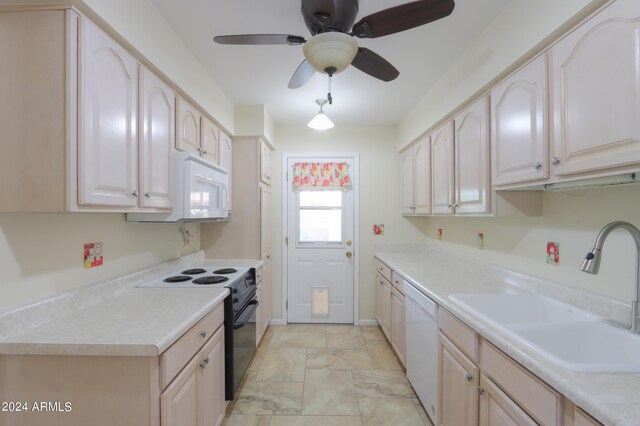 kitchen with white appliances, light brown cabinets, light tile patterned floors, ceiling fan, and sink