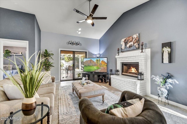 living room with lofted ceiling, a brick fireplace, and ceiling fan