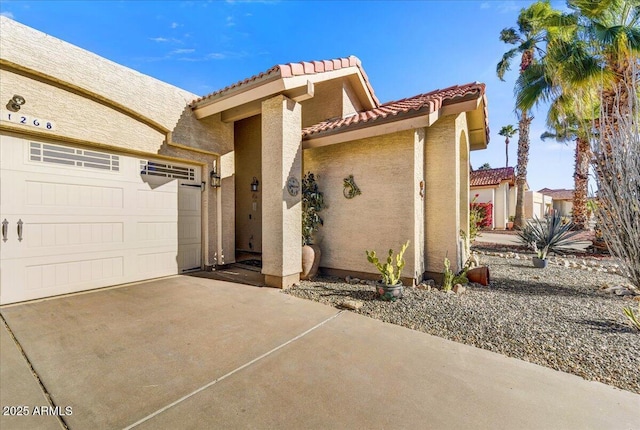 mediterranean / spanish house with a garage