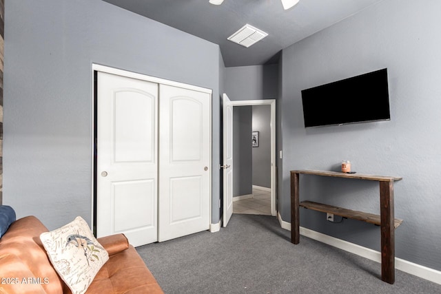 interior space featuring carpet flooring, visible vents, and baseboards