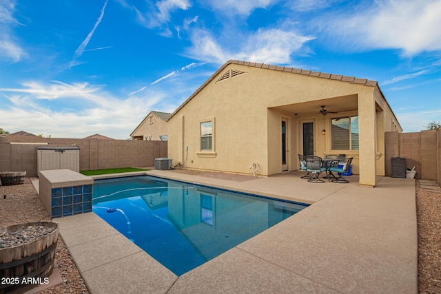 view of pool featuring a fenced backyard, ceiling fan, a fenced in pool, and a patio