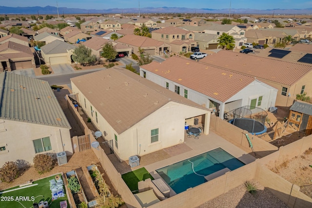 birds eye view of property with a residential view