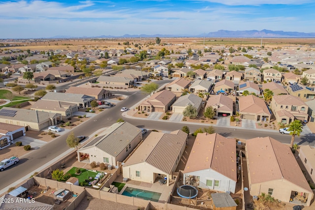 birds eye view of property featuring a mountain view and a residential view