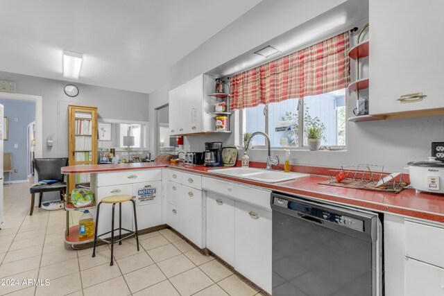 kitchen with black dishwasher, white cabinets, a sink, open shelves, and a wealth of natural light