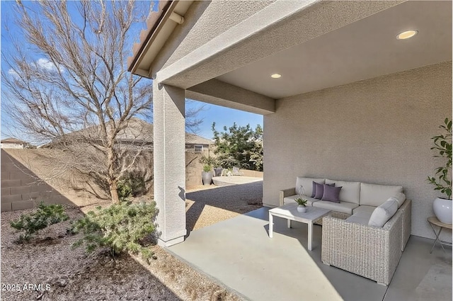 view of patio with outdoor lounge area and a fenced backyard