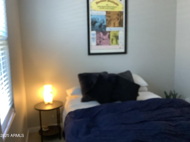 bedroom featuring baseboards