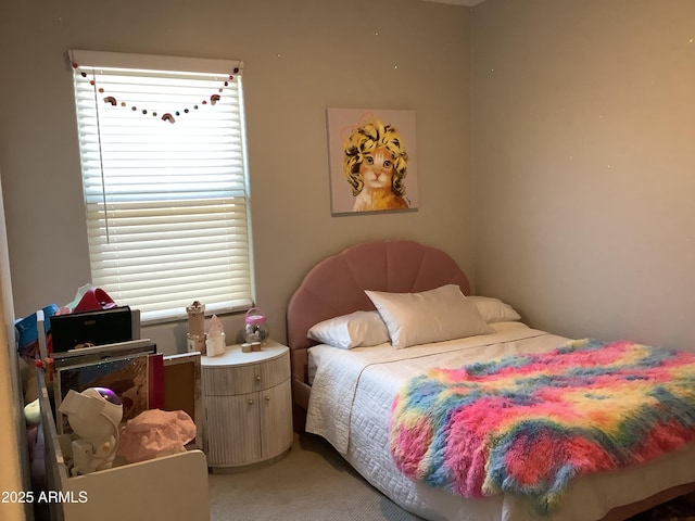 bedroom featuring light colored carpet